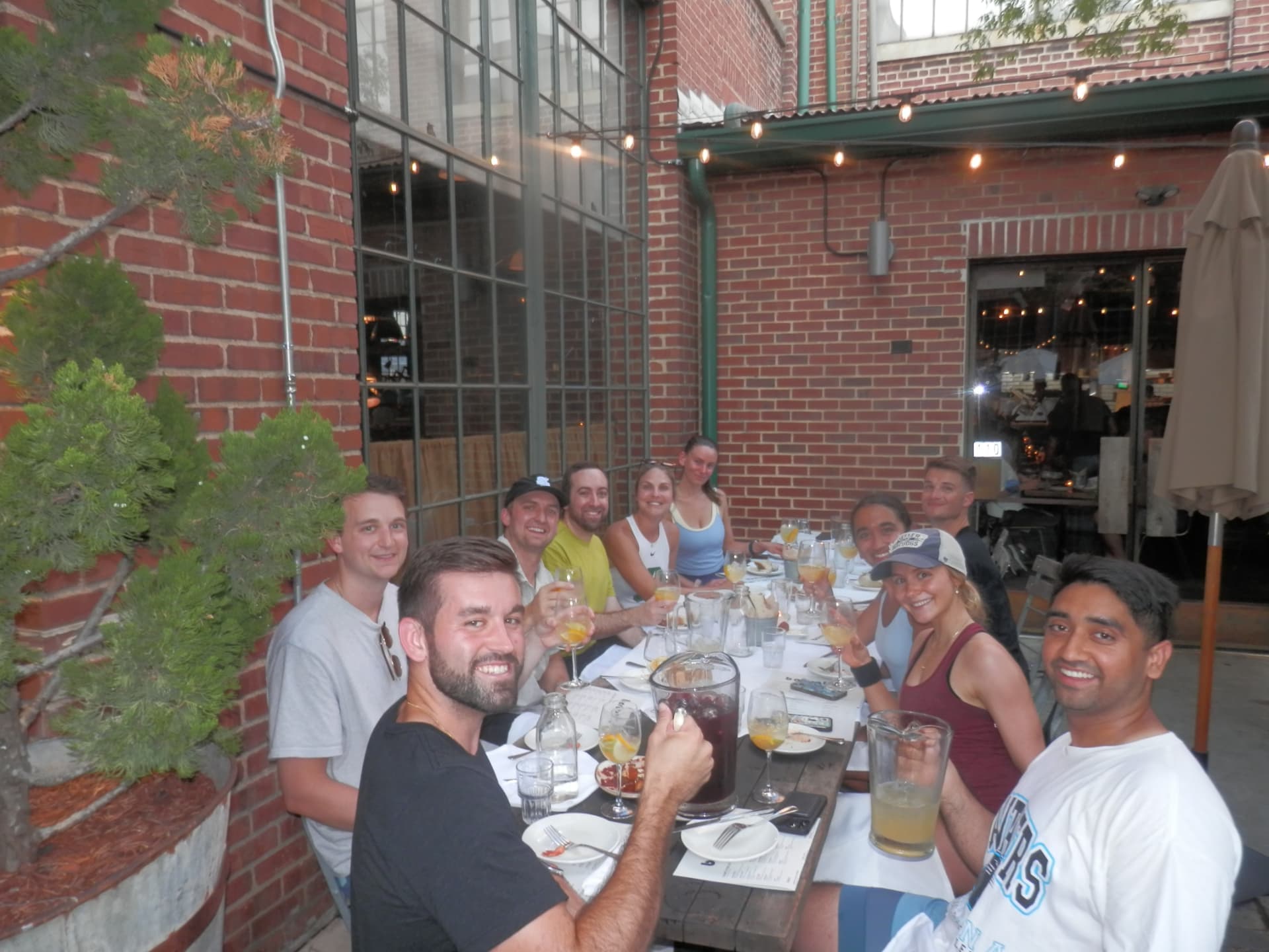 The Tardeo group around the long shared table on the patio